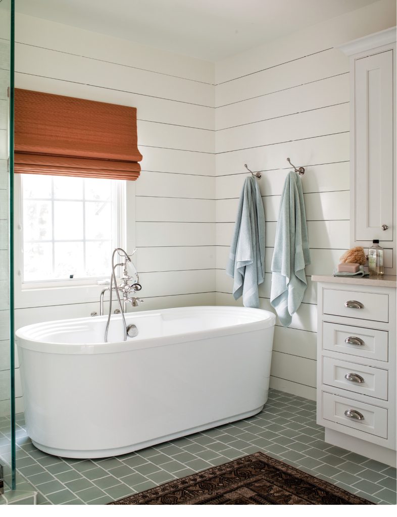 “Shiplap walls add texture and character to a brand-new bathroom. Soaking tubs are not only incredibly relaxing, but they also add a sculptural element to a space. I often have square tiles laid in a subway pattern for added subtle interest.”
