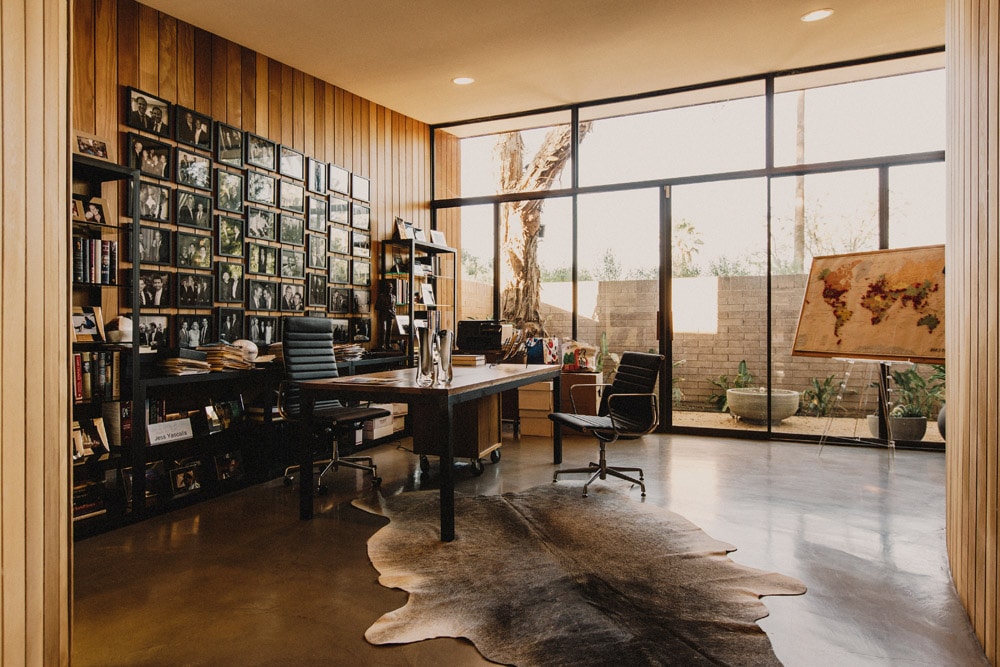 home office mid-century modern home studio desk wood rug natural lighting